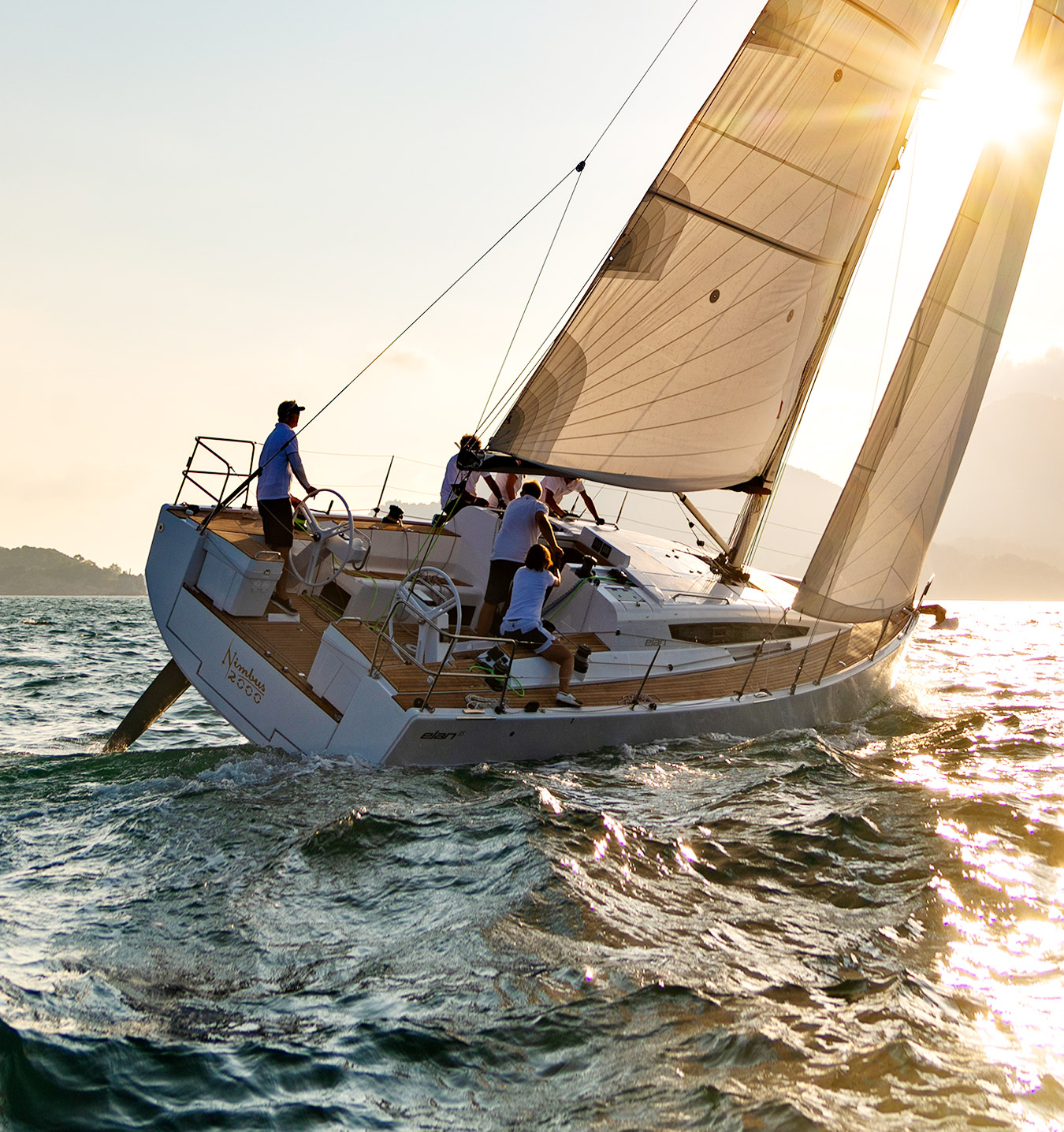 elan-e5-performance-cruiser-sailing-upwind-in-sunset