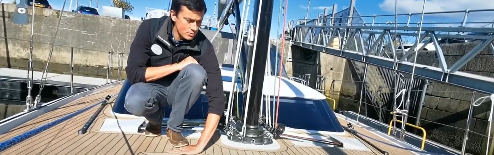 Toby from Great Harbour Yachts on deck of the Elan Yachts Elan GT6 during a walkthrough video