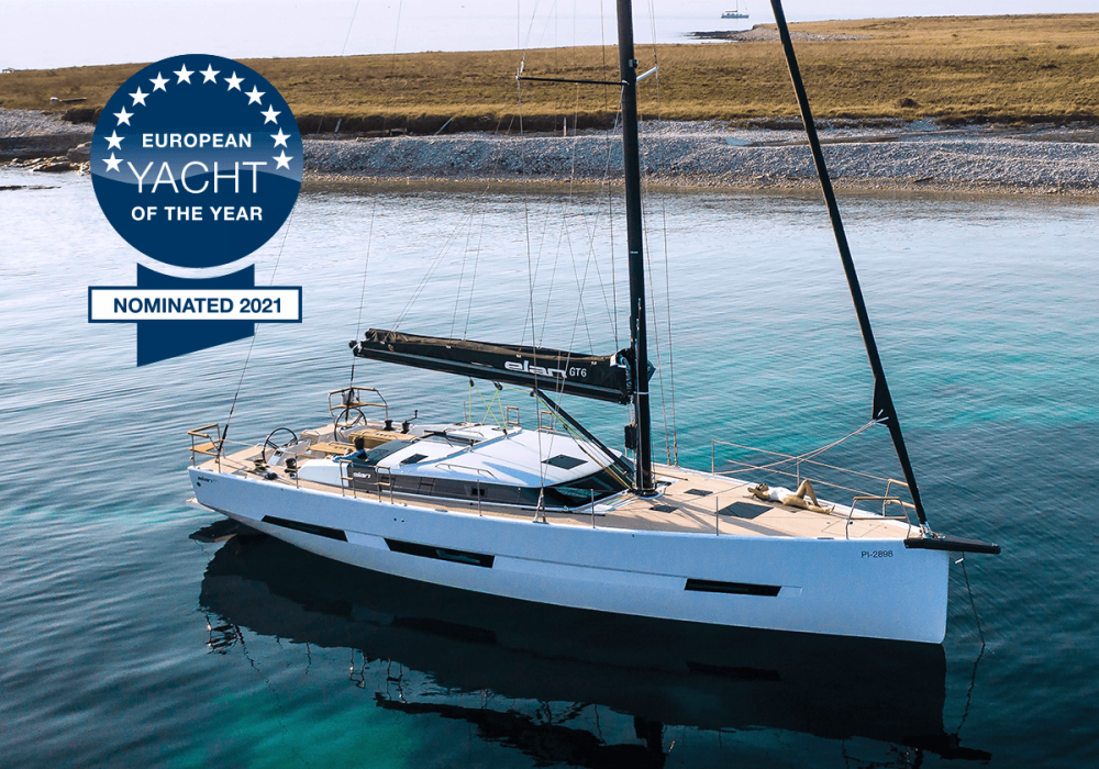 Elan Yachts Elan GT6 anchored over turquoise water and overlaid with European Yachts of the Year 2021 nominated logo